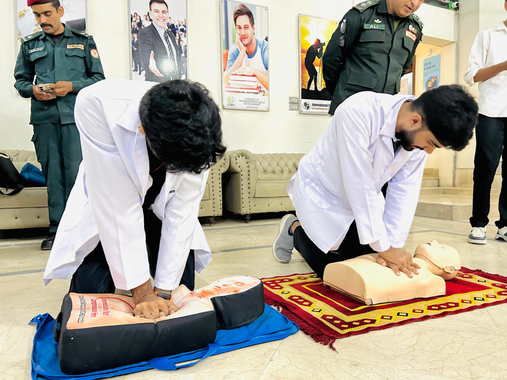 Student pairs practising chest compressions