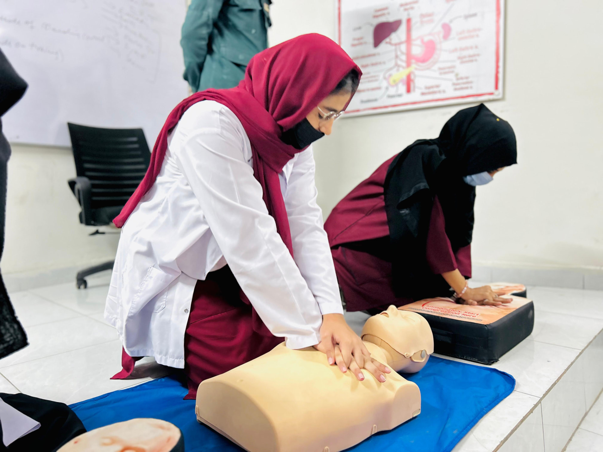 Students practising lifesaving techniques